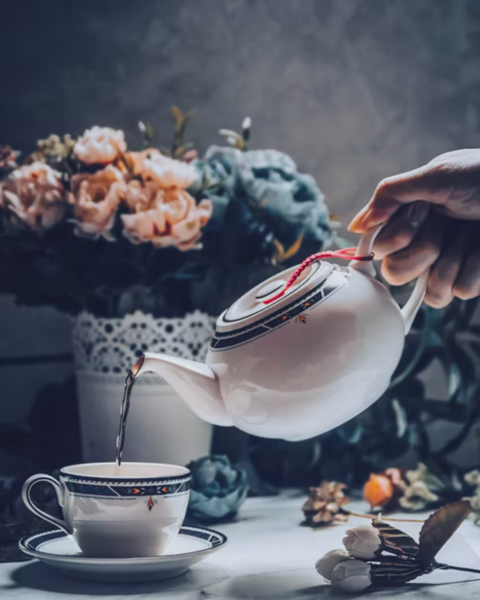 Pouring tea into a cup